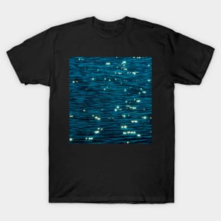 Beautiful shiny reflections of the sea surface on a sunny summer day T-Shirt